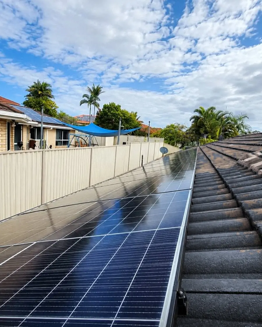 Row of solar panels on a tile roof